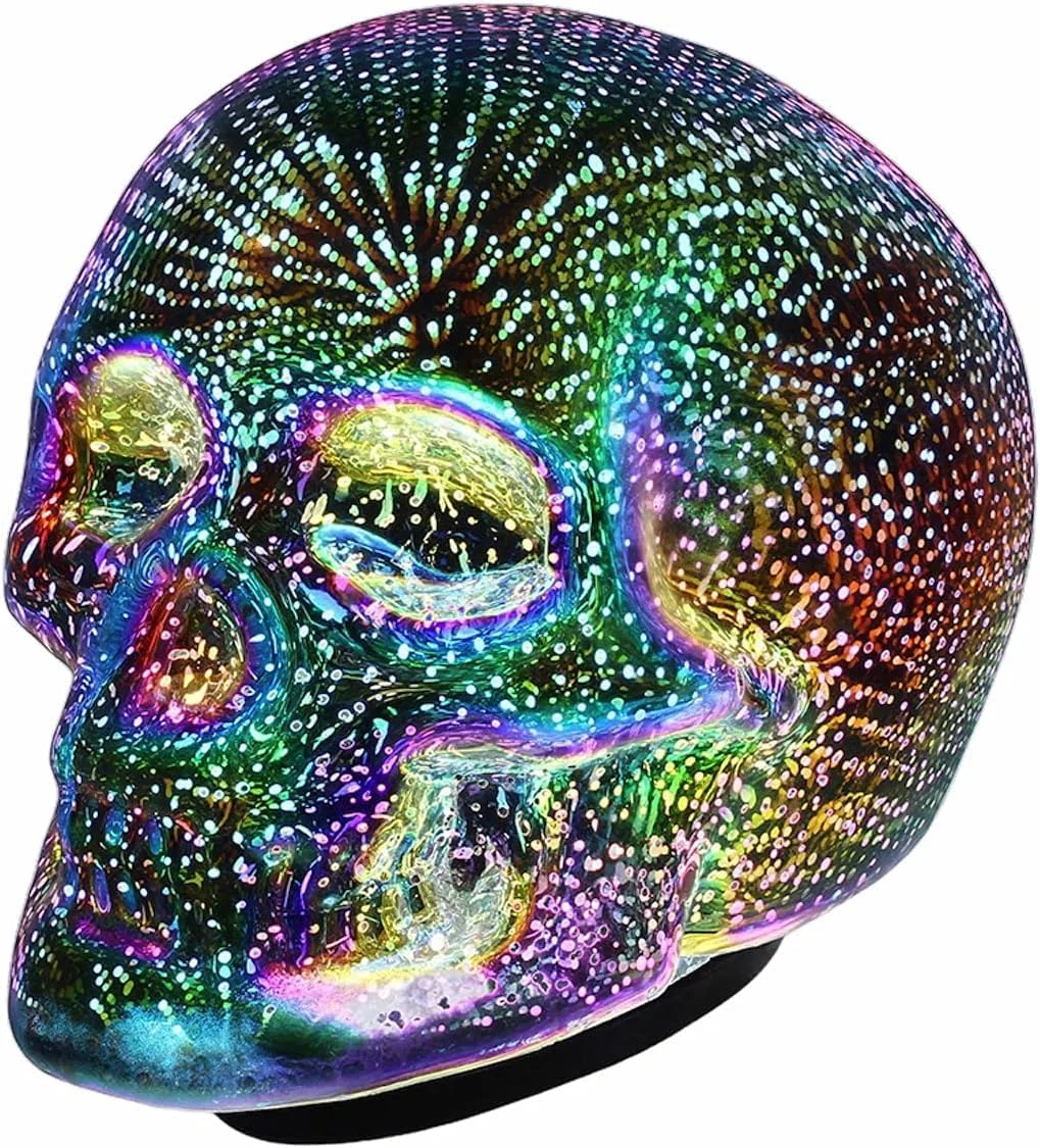 Molded plastic skull table lamp with internal LED illumination, battery-powered, real product photo