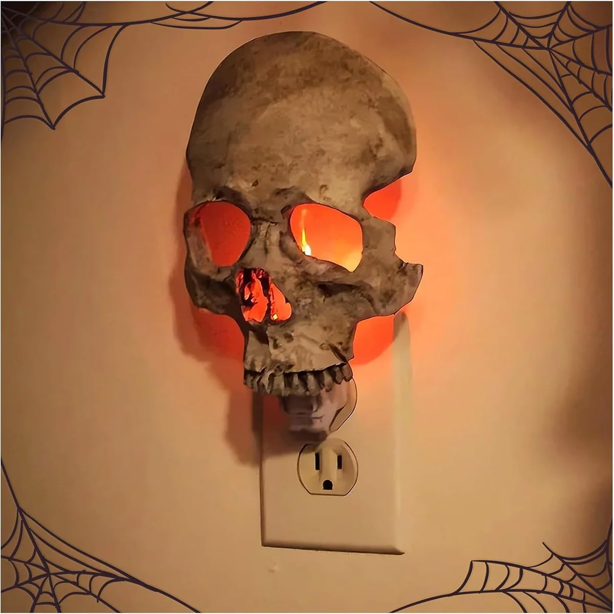 Grey plastic skull night light with LED illumination, skeleton silhouette form